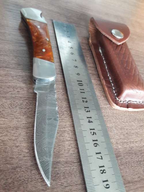 Handmade Damascus steel folding knife with Resin handle scales.
