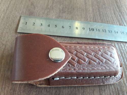Handmade Damascus steel folding knife with Bull Horn handle scales.