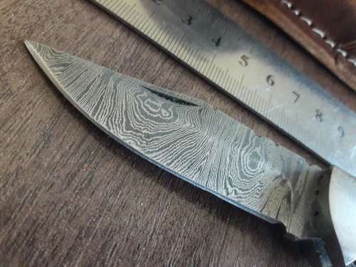 Handmade Damascus steel folding knife with Resin handle scales.