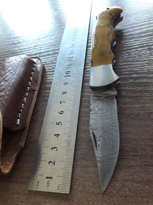 Handmade Damascus steel folding knife with Resin handle scales.
