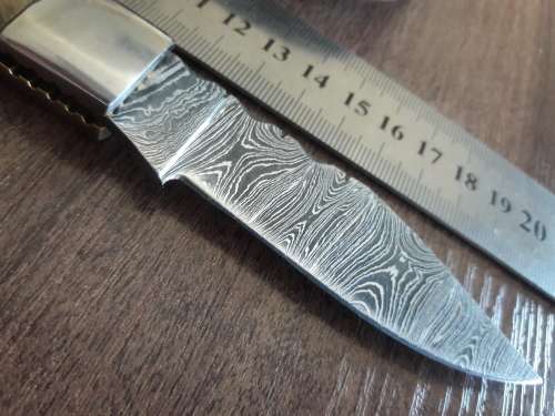 Handmade Damascus steel folding knife with RAM HORN handle scales.