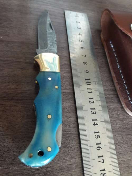 Handmade Damascus steel folding knife with Camel Bone handle scales.