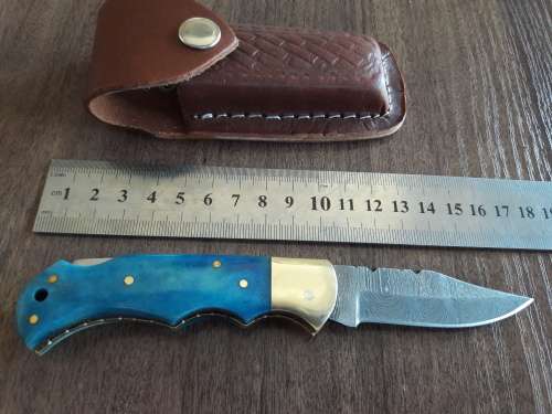 Handmade Damascus steel folding knife with Camel Bone handle scales.