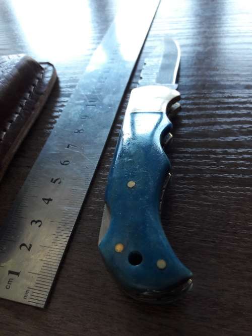 Handmade Damascus steel folding knife with Camel Bone handle scales.