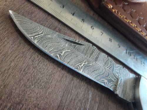 Handmade Damascus steel folding knife with Wooden handle scales.