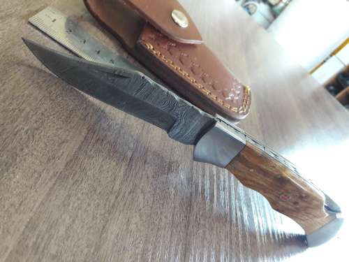 Handmade Damascus steel folding knife with Wooden handle scales.
