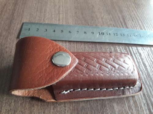 Handmade Damascus steel folding knife with Wooden handle scales.