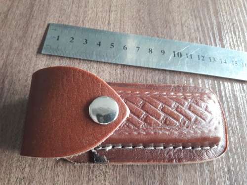 Handmade Damascus steel folding knife with Wooden handle scales.