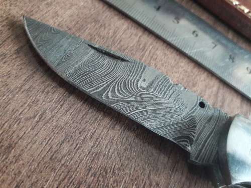 Handmade Damascus steel folding knife with Wooden handle scales.