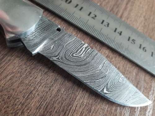 Handmade Damascus steel folding knife with Wooden handle scales.