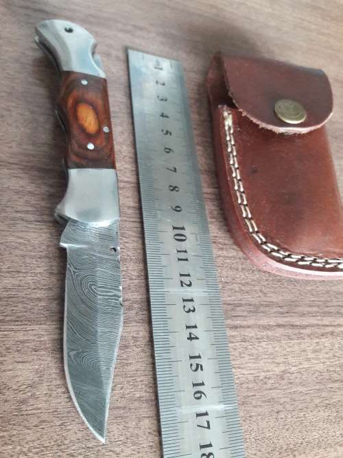 Handmade Damascus steel folding knife with Wooden handle scales.