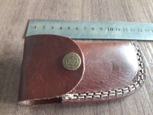 Handmade Damascus steel folding knife with Wooden handle scales.