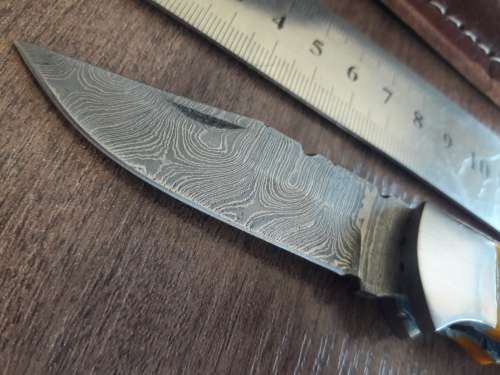 Handmade Damascus steel folding knife with Resin handle scales.