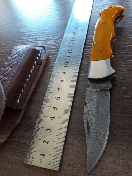 Handmade Damascus steel folding knife with Resin handle scales.