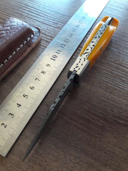 Handmade Damascus steel folding knife with Resin handle scales.