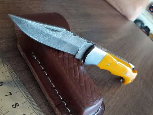 Handmade Damascus steel folding knife with Resin handle scales.