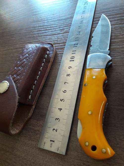 Handmade Damascus steel folding knife with Resin handle scales.