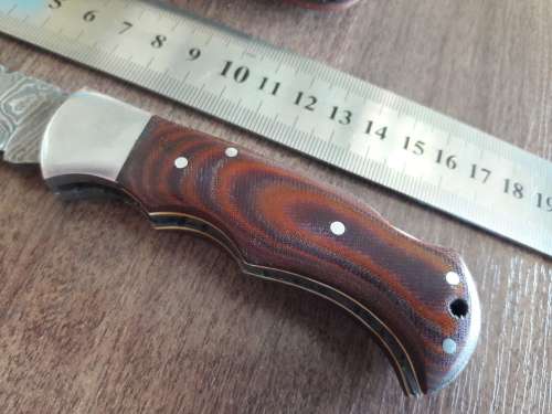 Handmade Damascus steel folding knife with MICARTA handle scales. THIS AUCTION will only ship 28th