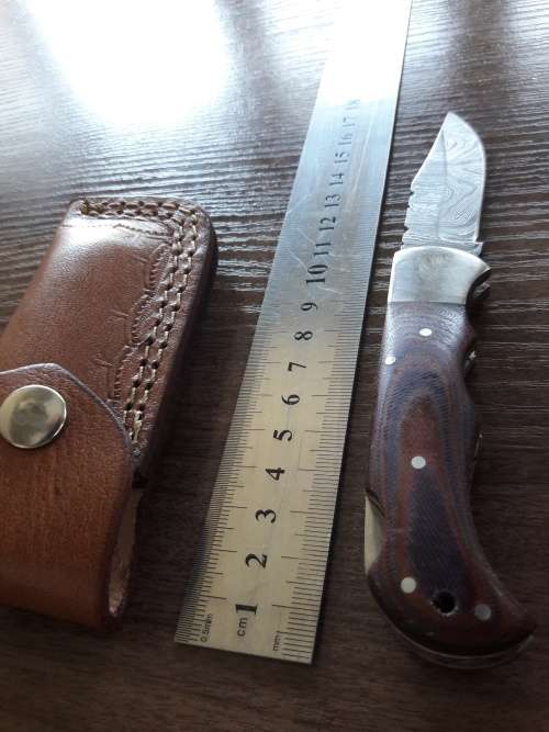 Handmade Damascus steel folding knife with MICARTA handle scales. THIS AUCTION will only ship 28th
