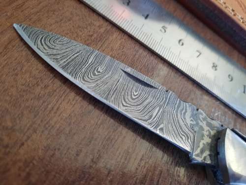 Handmade Damascus steel folding knife with Wooden handle scales.
