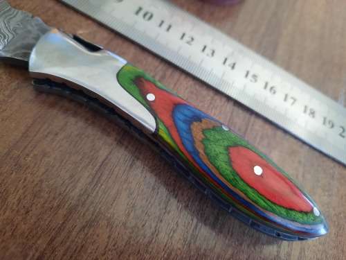 Handmade Damascus steel folding knife with Wooden handle scales.