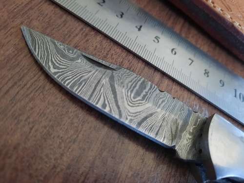 Handmade Damascus steel folding knife with MICARTA handle scales.