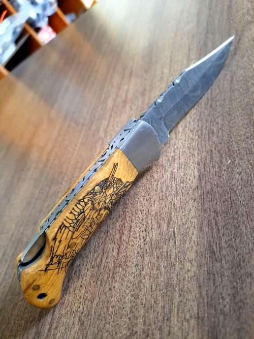Handmade Damascus steel folding knife with wooden handle scales. OWL picture engraved. NEW STOCK !