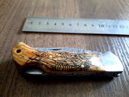 Handmade Damascus steel folding knife with wooden handle scales. OWL picture engraved. NEW STOCK !