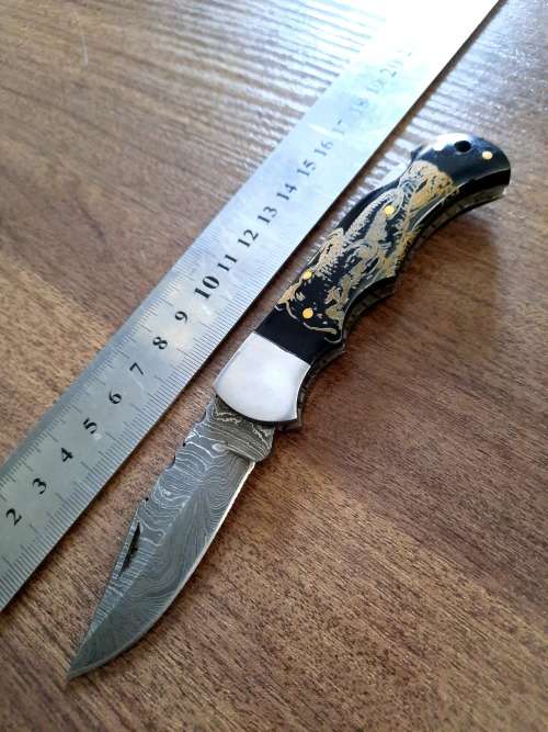 Handmade Damascus steel folding knife with Bull Horn Handle. Elephant picture engraved. NEW STOCK !