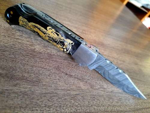Handmade Damascus steel folding knife with Bull Horn Handle. Elephant picture engraved. NEW STOCK !