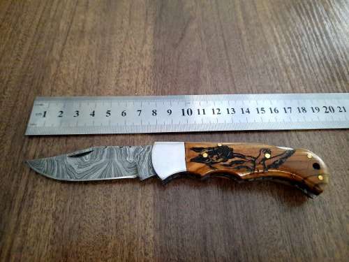 Handmade Damascus steel folding knife with wooden handle scales. Dog picture engraved. NEW STOCK !