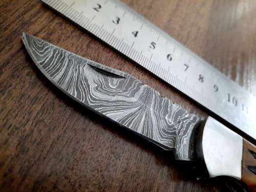 Handmade Damascus steel folding knife with wooden handle scales. Dog picture engraved. NEW STOCK !