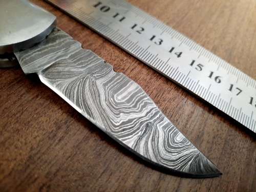 Handmade Damascus steel folding knife with wooden handle scales. Dog picture engraved. NEW STOCK !