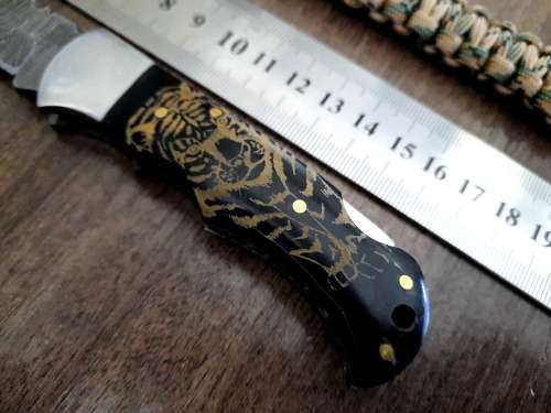 Handmade Damascus steel folding knife with Bull Horn handle scales. FREE SURVIVAL to the winner.