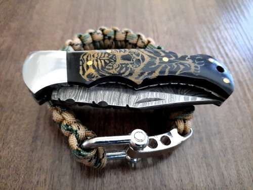 Handmade Damascus steel folding knife with Bull Horn handle scales. FREE SURVIVAL to the winner.