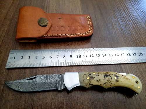 Handmade Damascus steel folding knife w Camel Bone Handle Scales. Art engraved.