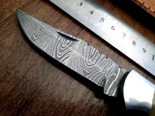 Handmade Damascus steel folding knife w Camel Bone Handle Scales. Art engraved.