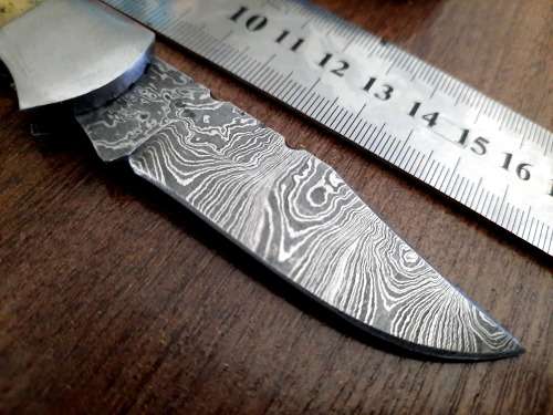 Handmade Damascus steel folding knife w Camel Bone Handle Scales. Art engraved.
