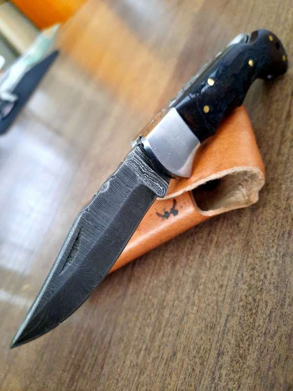 Handmade Damascus steel folding knife with wooden handle scales. Picture engraved. NEW STOCK !