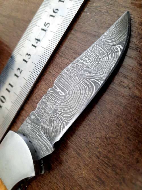 Handmade Damascus steel folding knife with wooden handle scales. Picture engraved. NEW STOCK !
