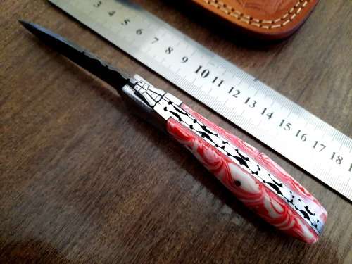 Handmade Damascus steel folding knife with Epoxy Resin handle scales.