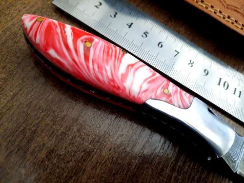 Handmade Damascus steel folding knife with Epoxy Resin handle scales.