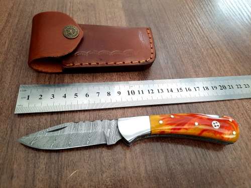 Handmade Damascus steel folding knife with Epoxy Resin handle scales. Crazy R1 start, no reserve.
