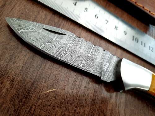 Handmade Damascus steel folding knife with Epoxy Resin handle scales. Crazy R1 start, no reserve.