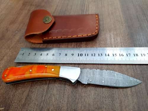 Handmade Damascus steel folding knife with Epoxy Resin handle scales. Crazy R1 start, no reserve.