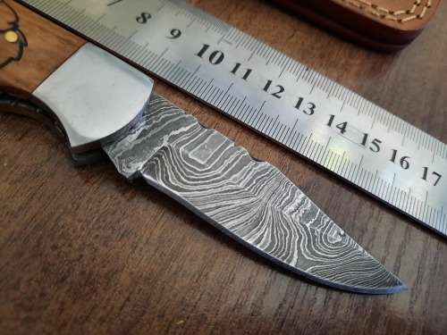 Handmade Damascus steel folding knife w Wooden Handle Scales. New stock !! LEATHER Pouch is BAD.