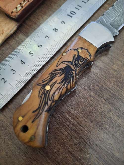 Handmade Damascus steel folding knife w Wooden Handle Scales. New stock !! LEATHER Pouch is BAD.