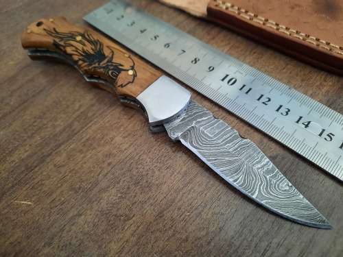 Handmade Damascus steel folding knife w Wooden Handle Scales. New stock !! LEATHER Pouch is BAD.