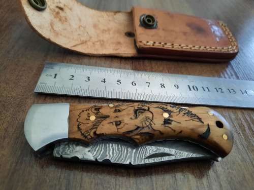 Handmade Damascus steel folding knife w Wooden Handle Scales. New stock !! LEATHER Pouch is BAD.