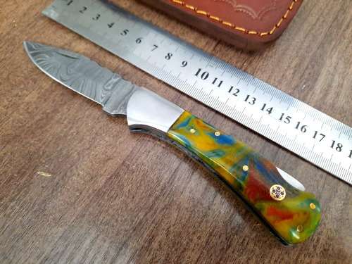 Handmade Damascus steel folding knife w Epoxy Handle Scales. New stock !!